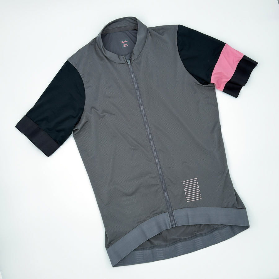 Rapha Women's Pro Team Training Jersey in grey, angled front view with pink armband