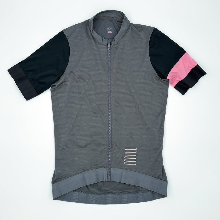 Rapha Women's Pro Team Training Jersey in grey, angled front view with pink armband (alternate view)