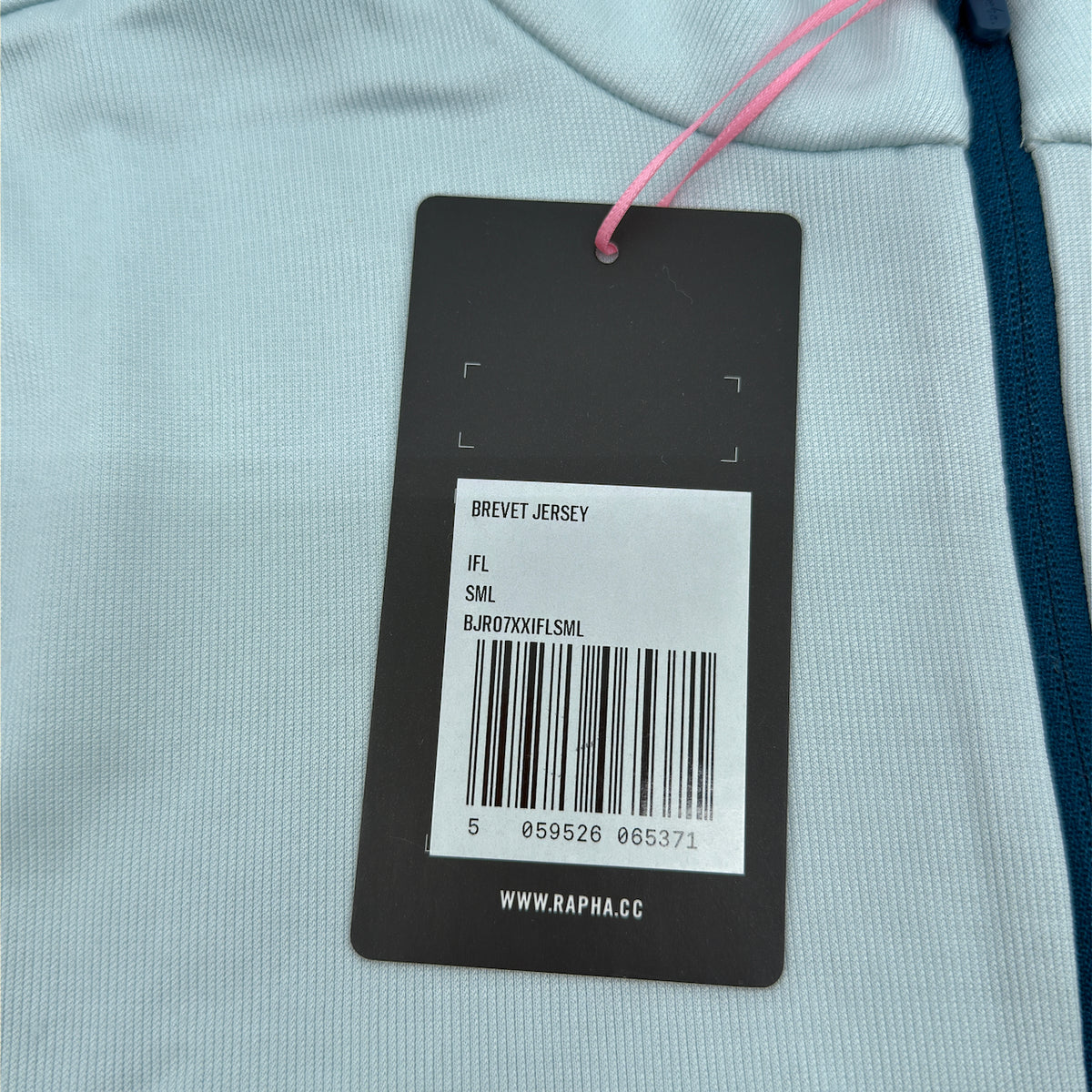 Rapha Men's Brevet Jersey II original swing tag showing product code BJR07XXIFLSML