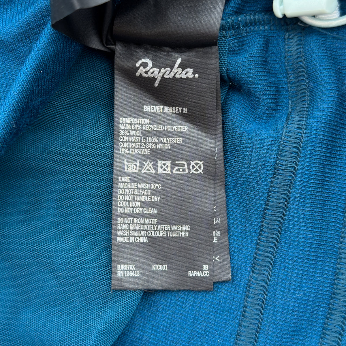 Rapha Brevet Jersey II care label showing RPM150 merino and recycled polyester composition