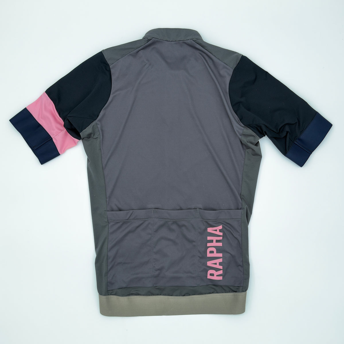 Rapha Men's Pro Team Training Jersey rear view showing vertical pink RAPHA print and three pockets