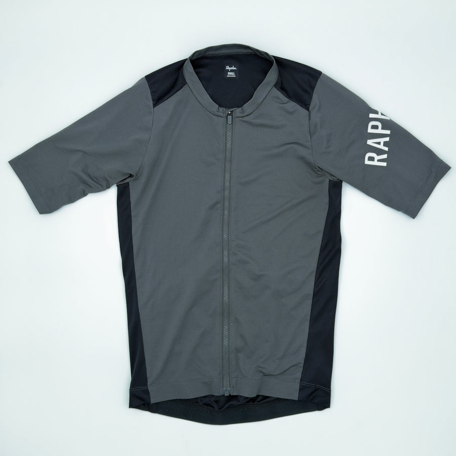 Rapha Men's Pro Team Training Jersey angled front view showing waffle-textured fabric and white RAPHA sleeve print (alternate view)