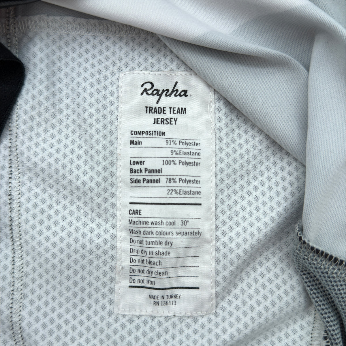 Rapha Trade Team Jersey care label showing composition and Made in Turkey
