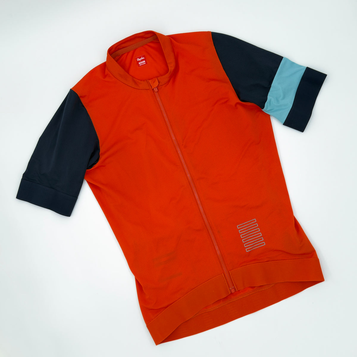 Rapha Pro Team Training Jersey angled front showing navy sleeves and pale blue arm band