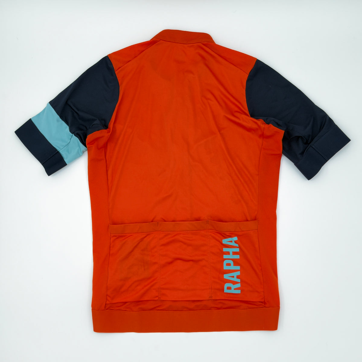 Rapha Pro Team Training Jersey rear view showing three pockets and pale blue RAPHA print