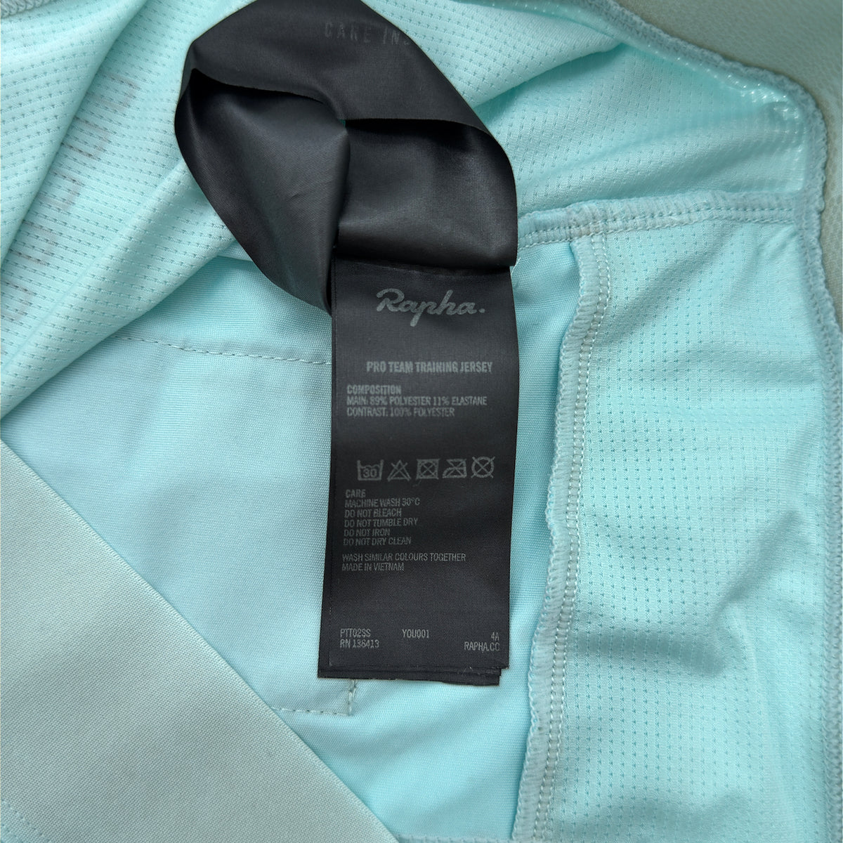 Rapha care label confirming Pro Team Training Jersey, code PTT02SS, Made in Vietnam