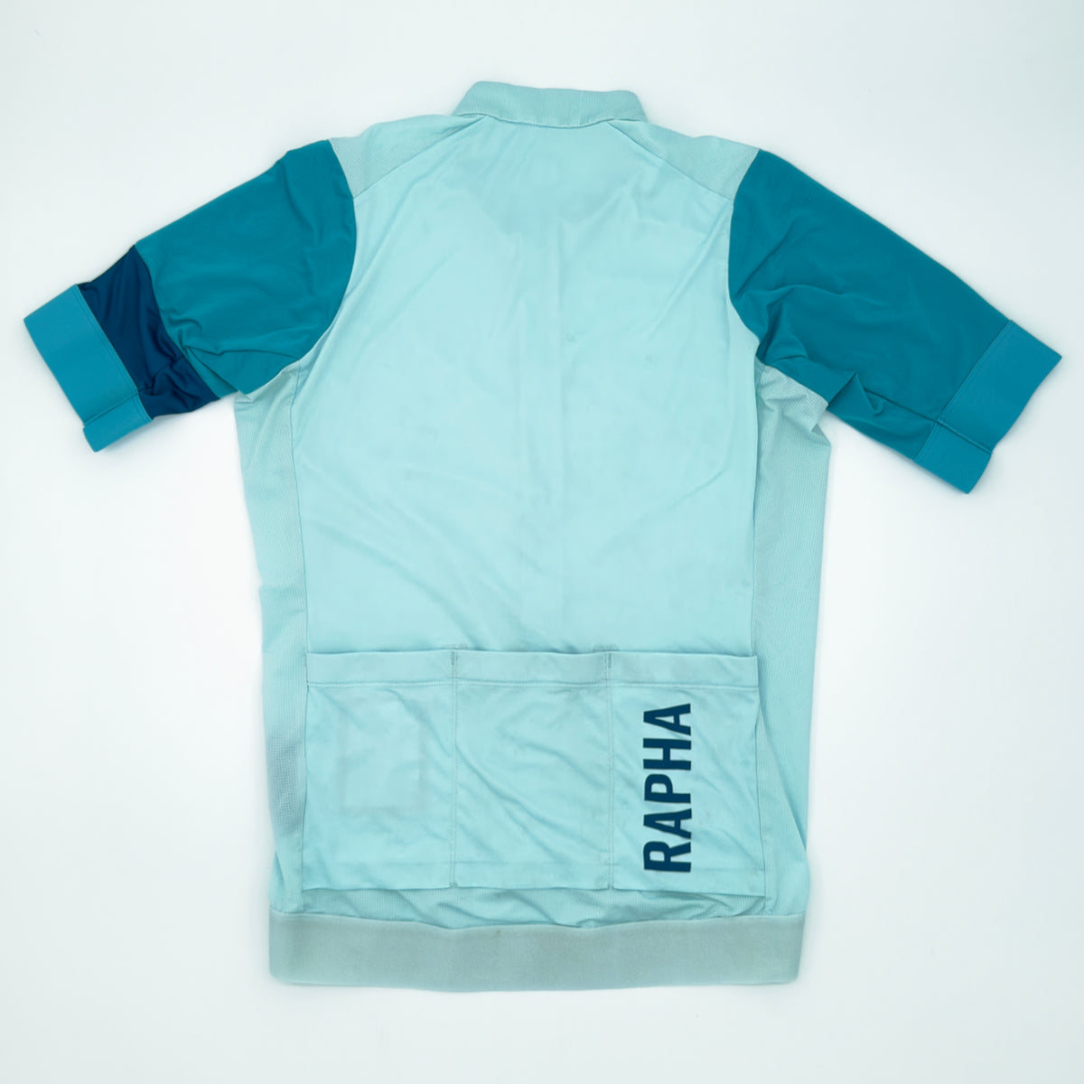Rapha Pro Team Training Jersey rear view showing three pockets and navy RAPHA print