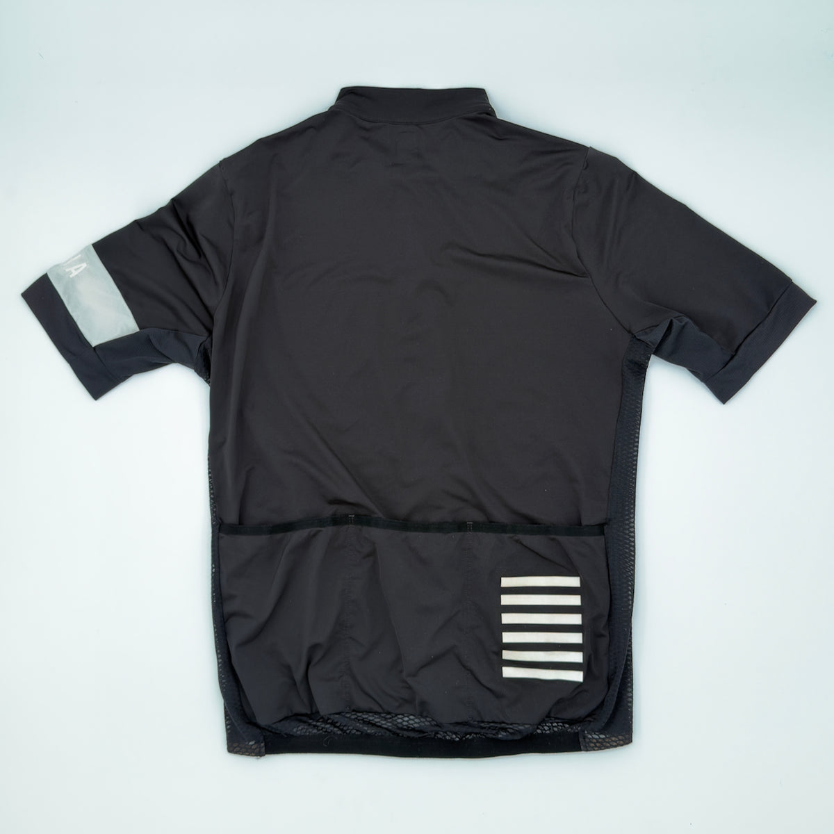 Rapha Pro Team Climber's Jersey rear view showing three pockets, mesh side panels and reflective bar print