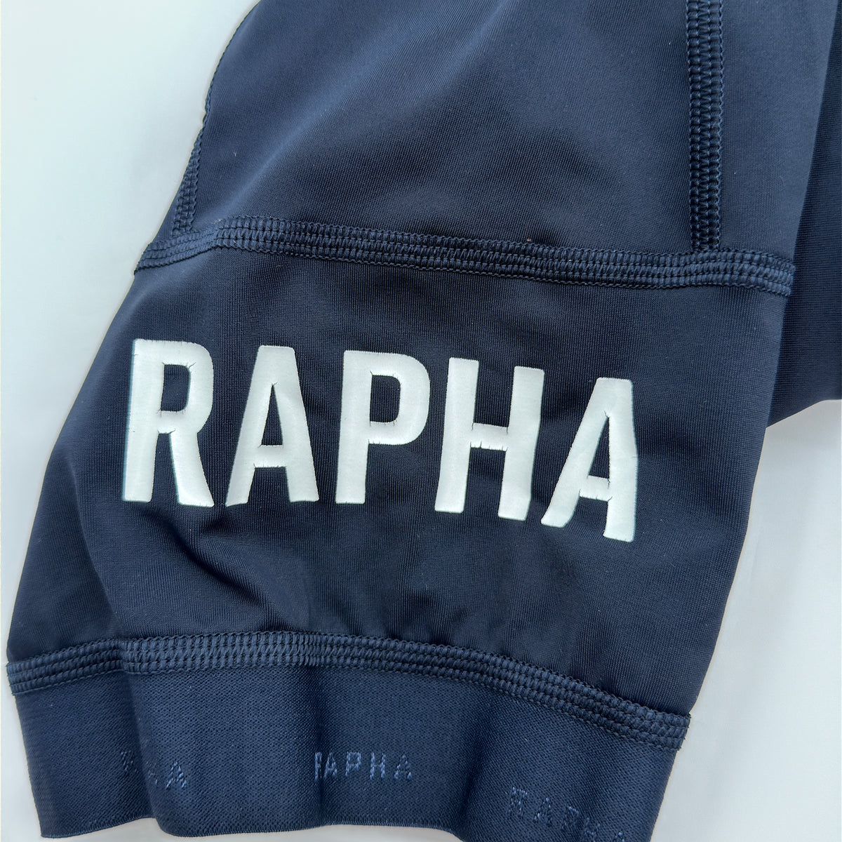 Rapha Pro Team Training Bib Shorts second leg showing RAPHA print and overlock stitch detailing