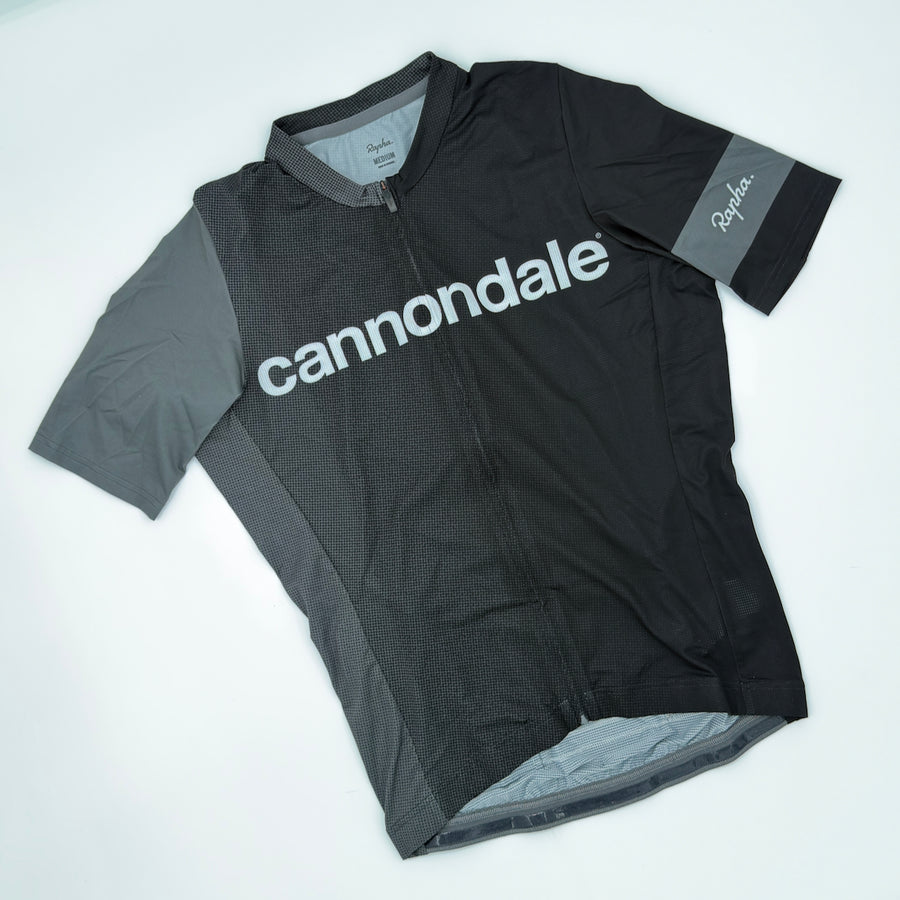 Rapha x Cannondale Pro Team Lightweight Jersey angled front showing grey cannondale wordmark and contrast shoulder panel