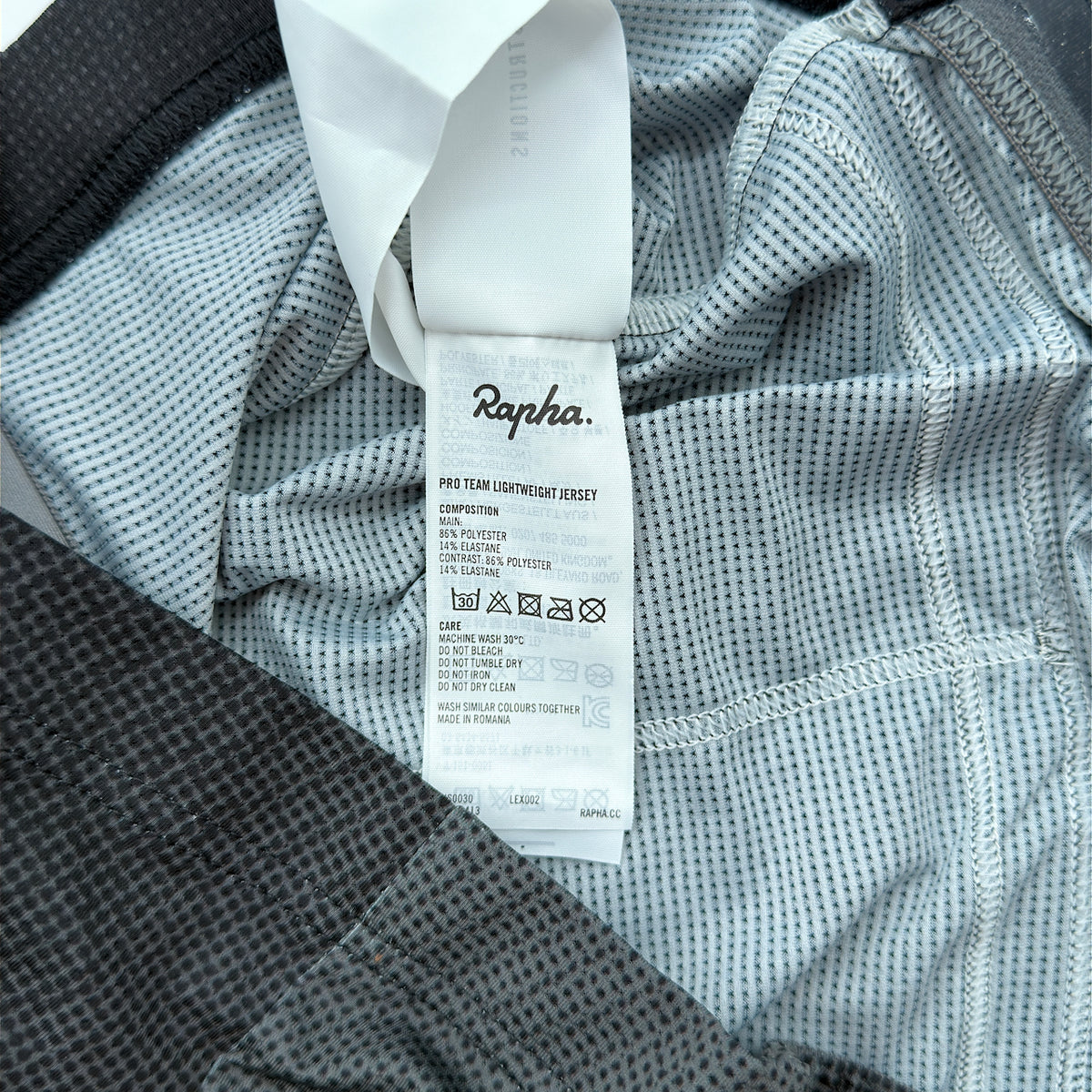 Rapha care label confirming Pro Team Lightweight Jersey composition and made in Romania