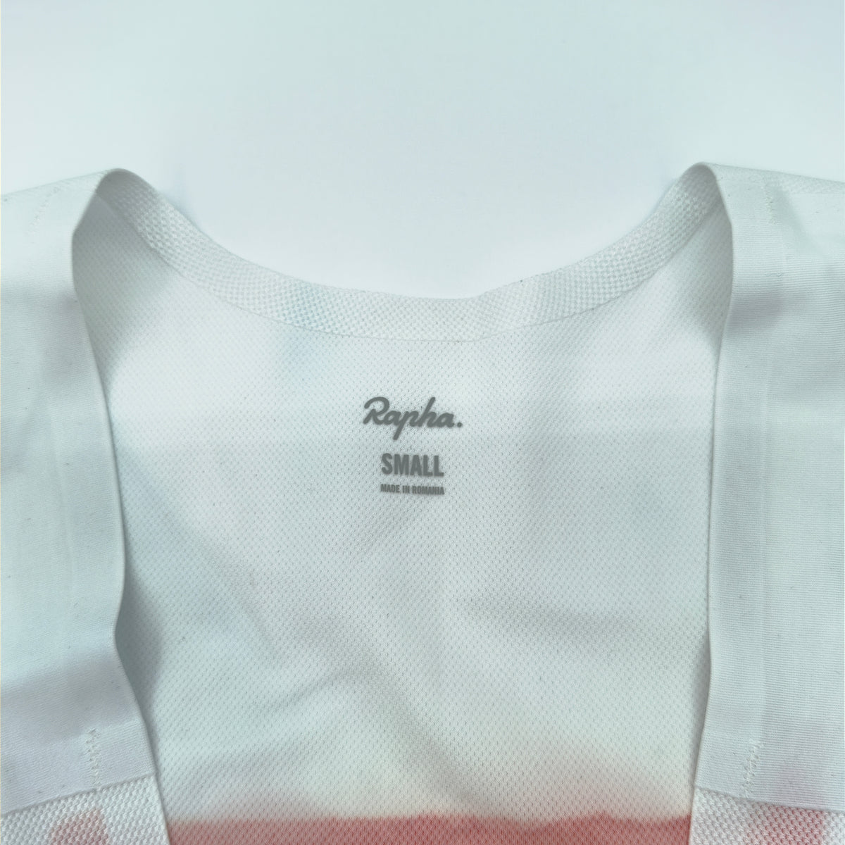 Rapha size label reading Small, made in Romania, on the mesh bib upper