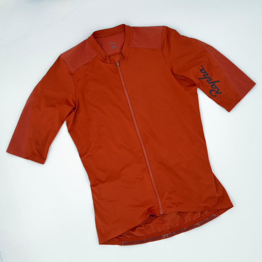 Rapha Souplesse Aero Jersey angled front showing rust colourway and textured sleeve panels