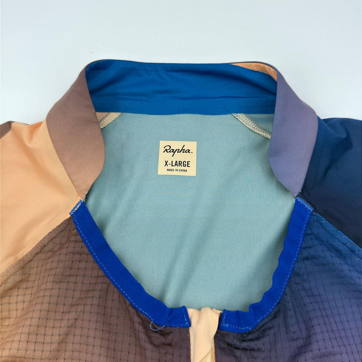 Rapha size label reading X-Large, made in China, at the contrast collar lining