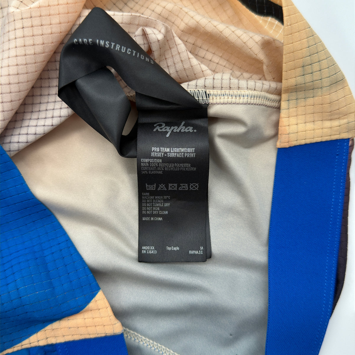 Rapha care label confirming Pro Team Lightweight Jersey Surface Print, recycled polyester composition and made in China
