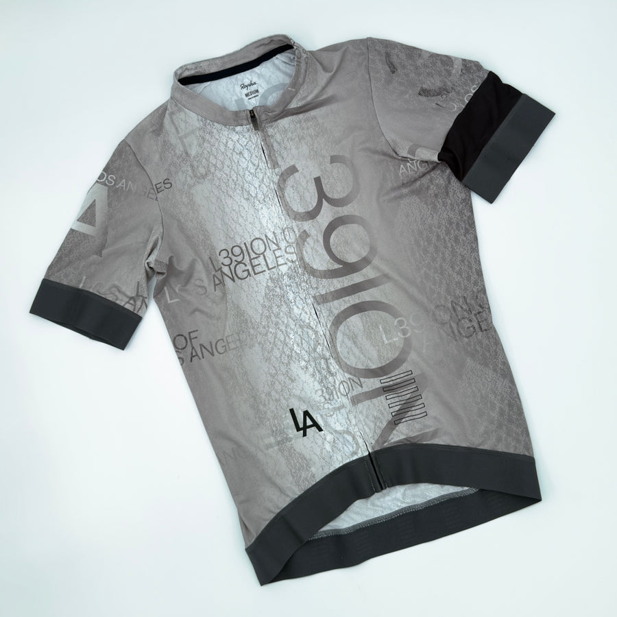 Rapha L39ION of Los Angeles Pro Team Training Jersey angled front showing all-over type print and charcoal cuff bands