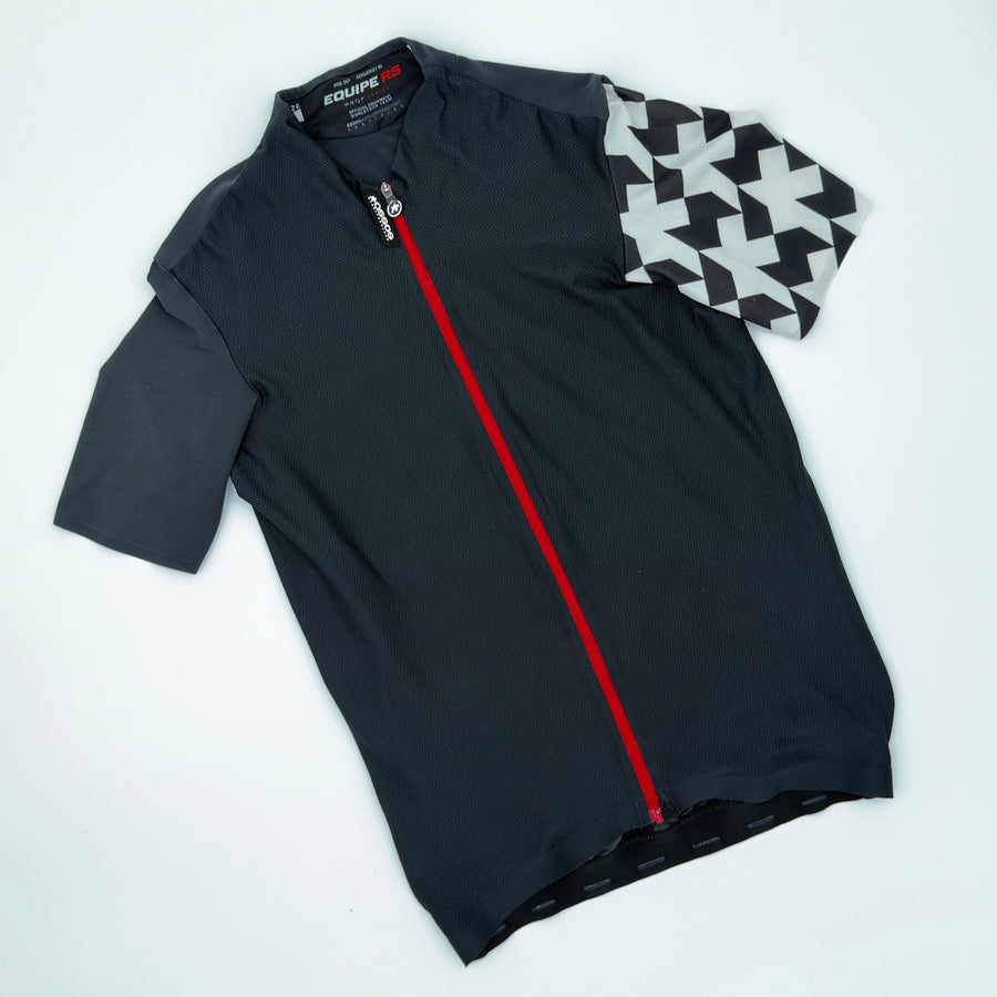 ASSOS Equipe RS Aero short sleeve jersey in black with white sleeve panels, laid flat front view