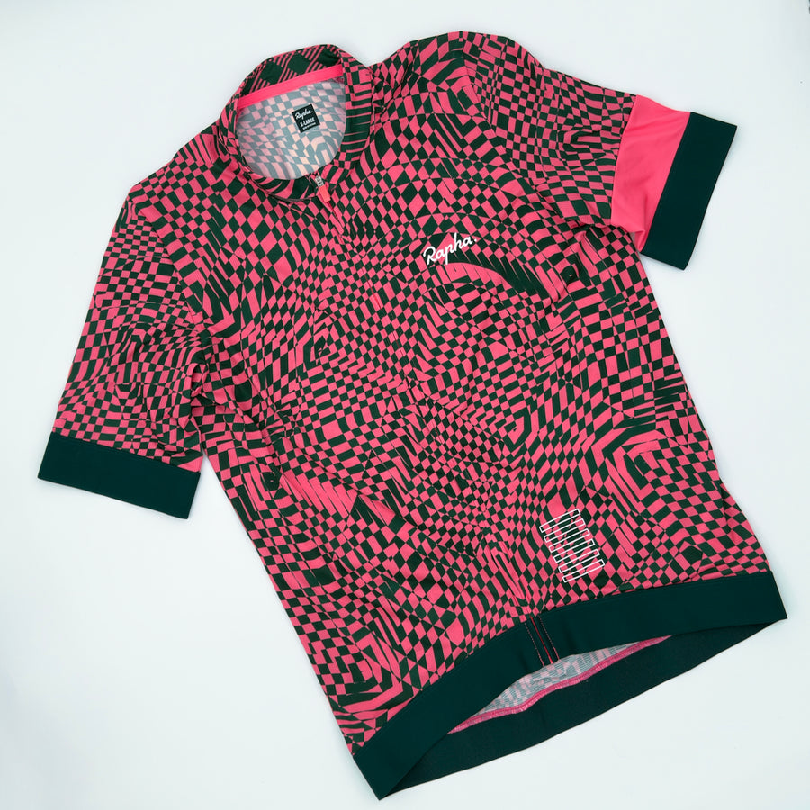 EF Education Pro Team Training Jersey angled front showing glitched checkerboard print and pink cuffs