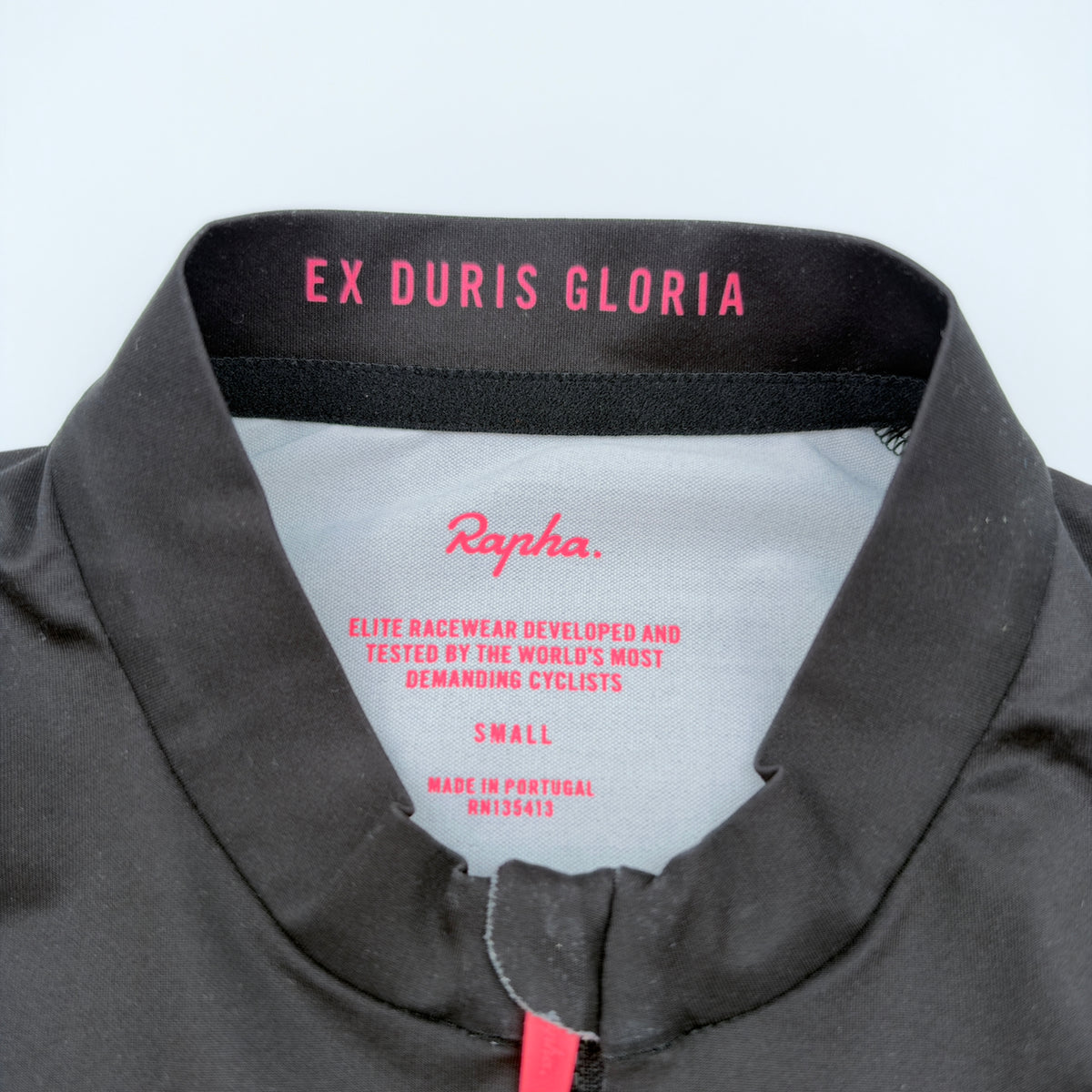 Neck label confirming size Small, made in Portugal, with Ex Duris Gloria printed inside the collar