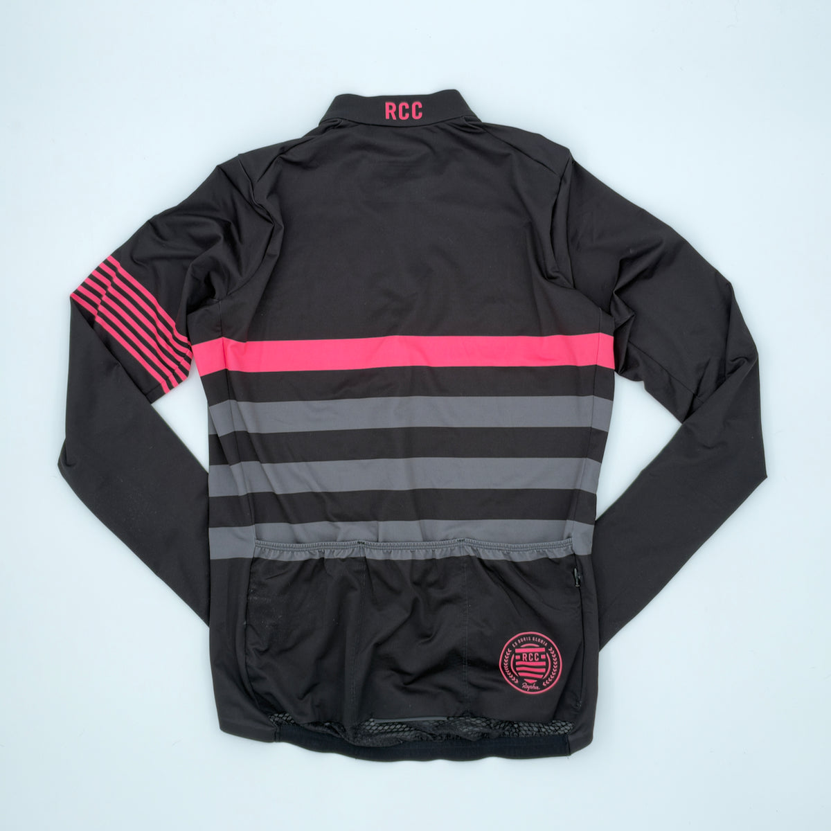 Rear view showing RCC roundel, three rear pockets, zipped valuables pocket and mesh gripper hem