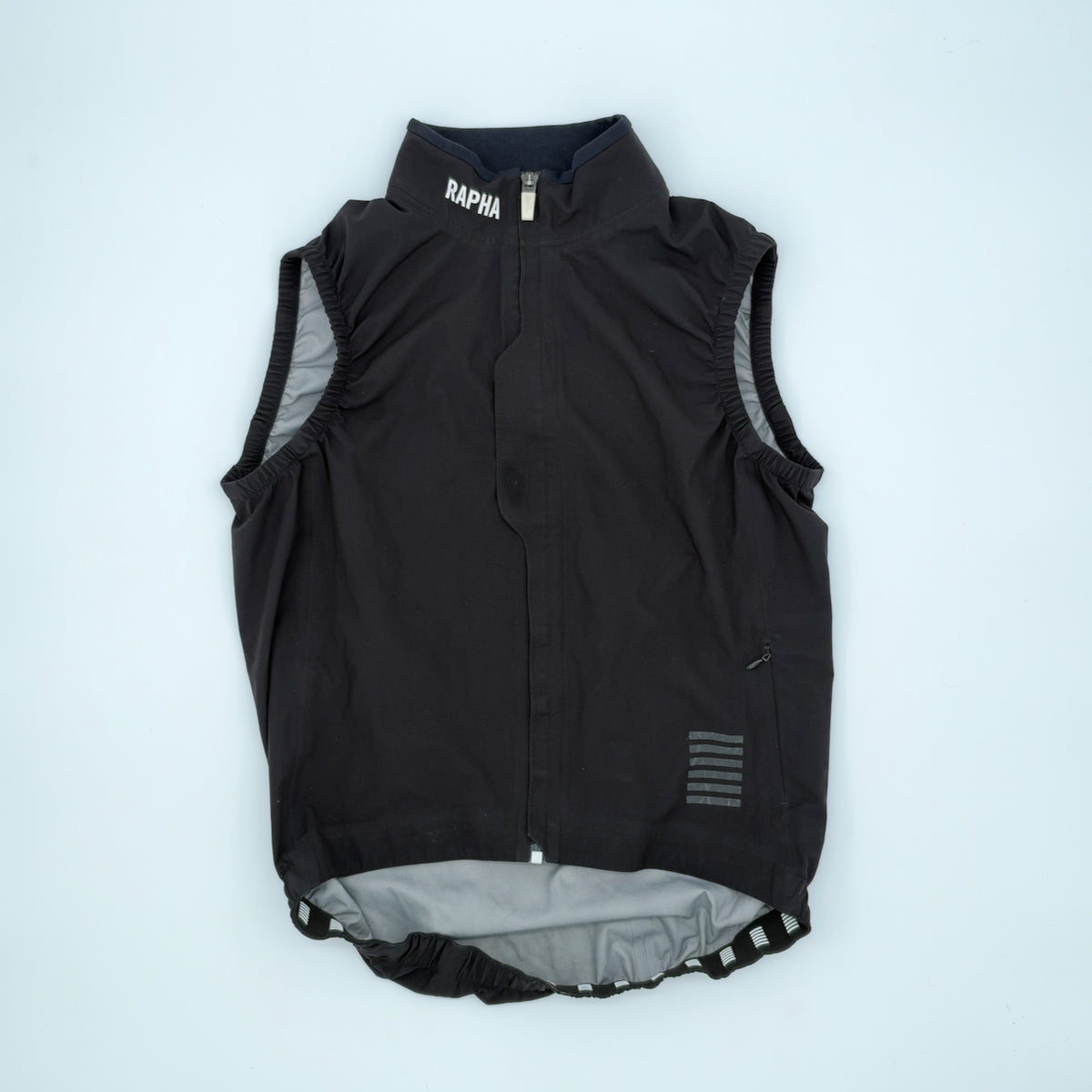 Angled view showing full-length zip, storm flap and elasticated armholes