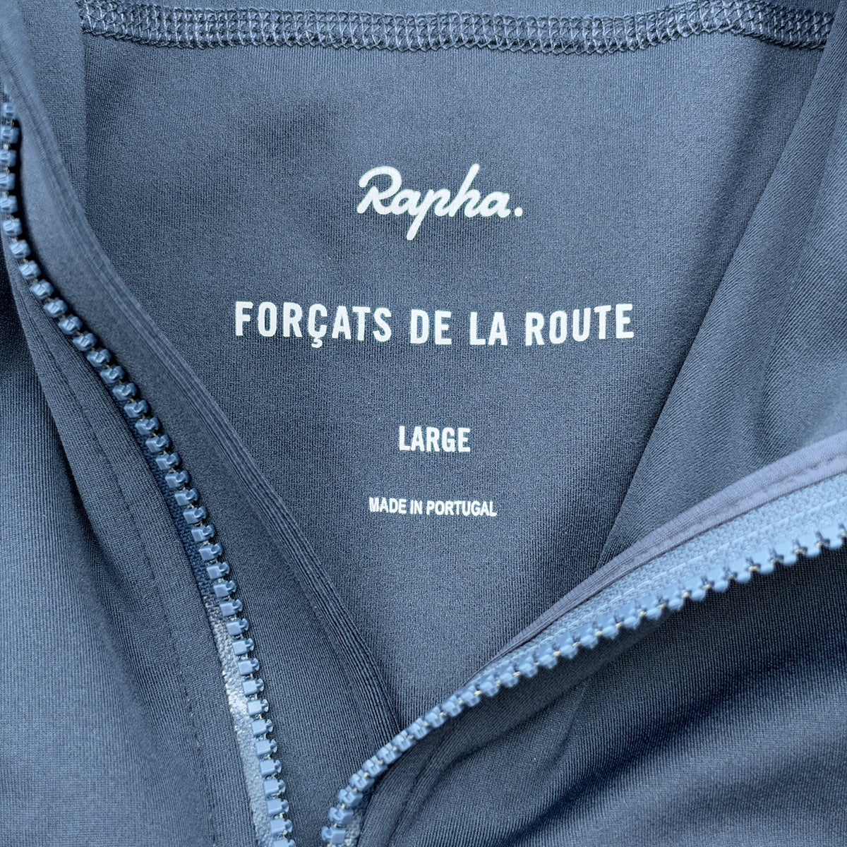Printed neck label reading Forçats de la Route, size Large, made in Portugal