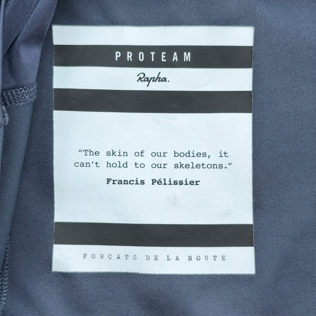 Inner Pro Team label carrying the Francis Pélissier quote and Forçats de la Route collection name