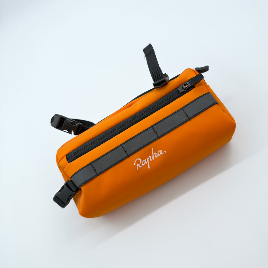 Angled view showing the reflective band, zip and mounting buckles
