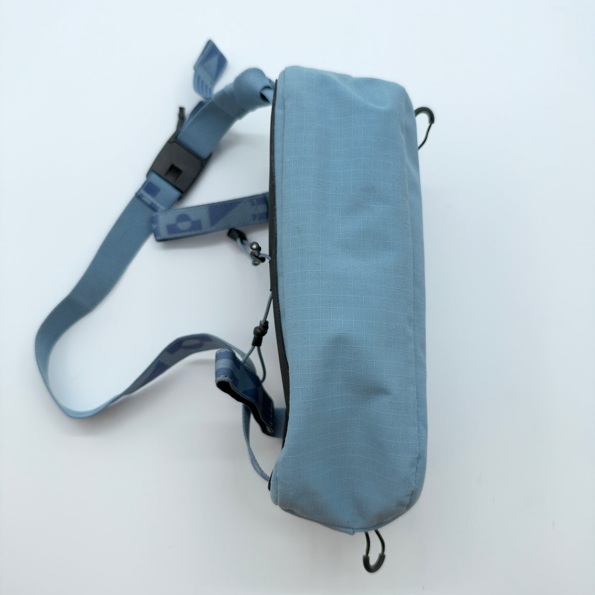 Bag shown with the shoulder strap attached and extended