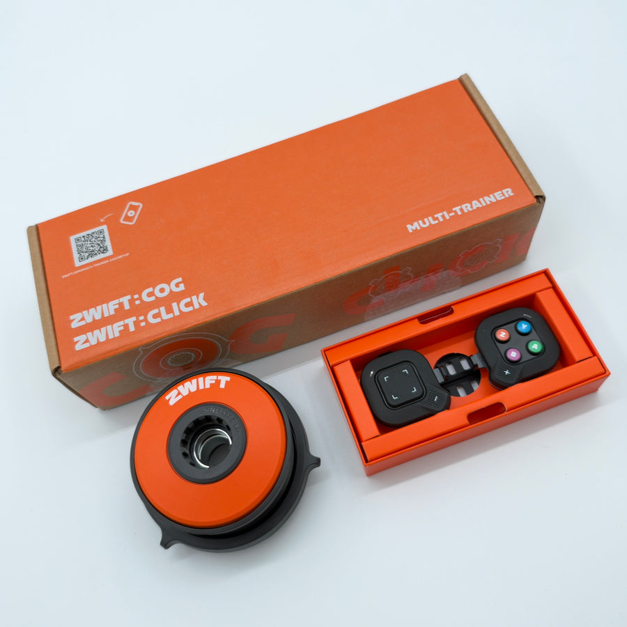Zwift Cog and Click Upgrade Kit shown angled with box, cog and Click controller tray