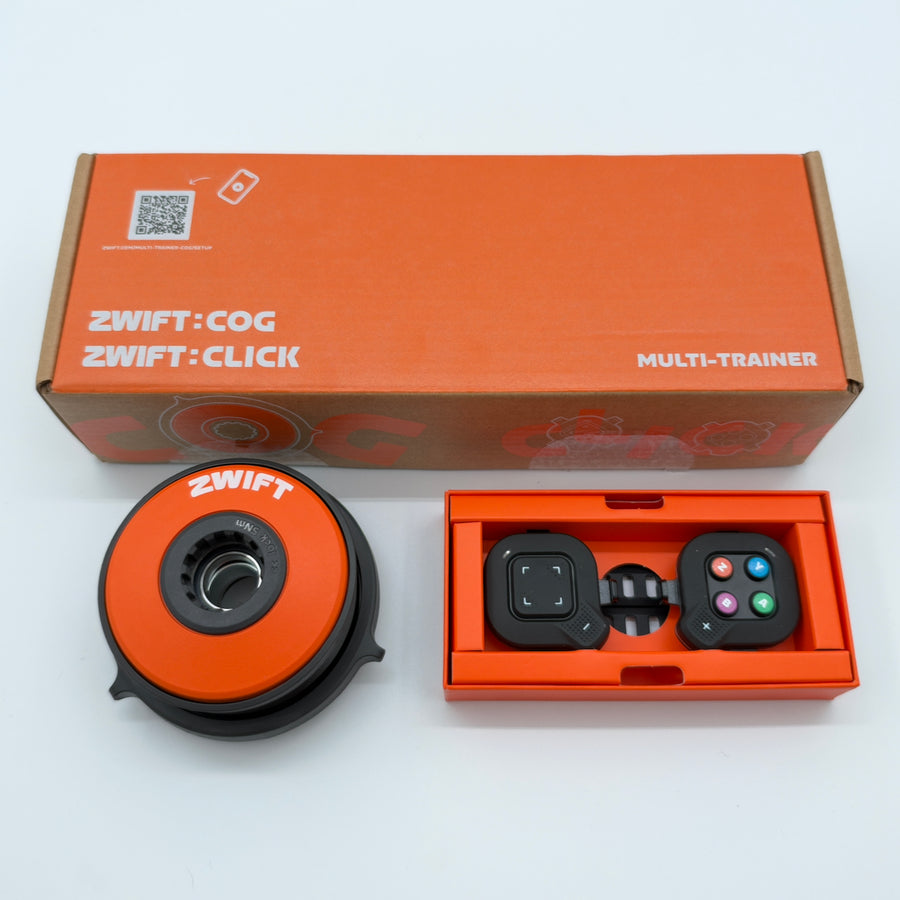 Zwift Cog and Click Upgrade Kit shown angled with box, cog and Click controller tray (alternate view)