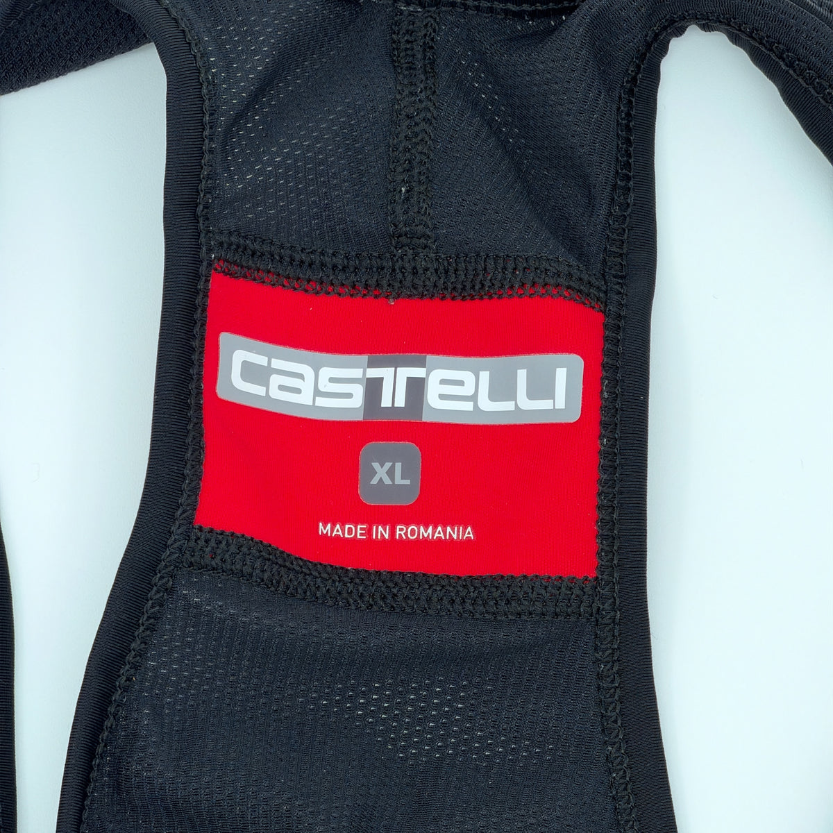 Castelli neck label showing size XL, made in Romania