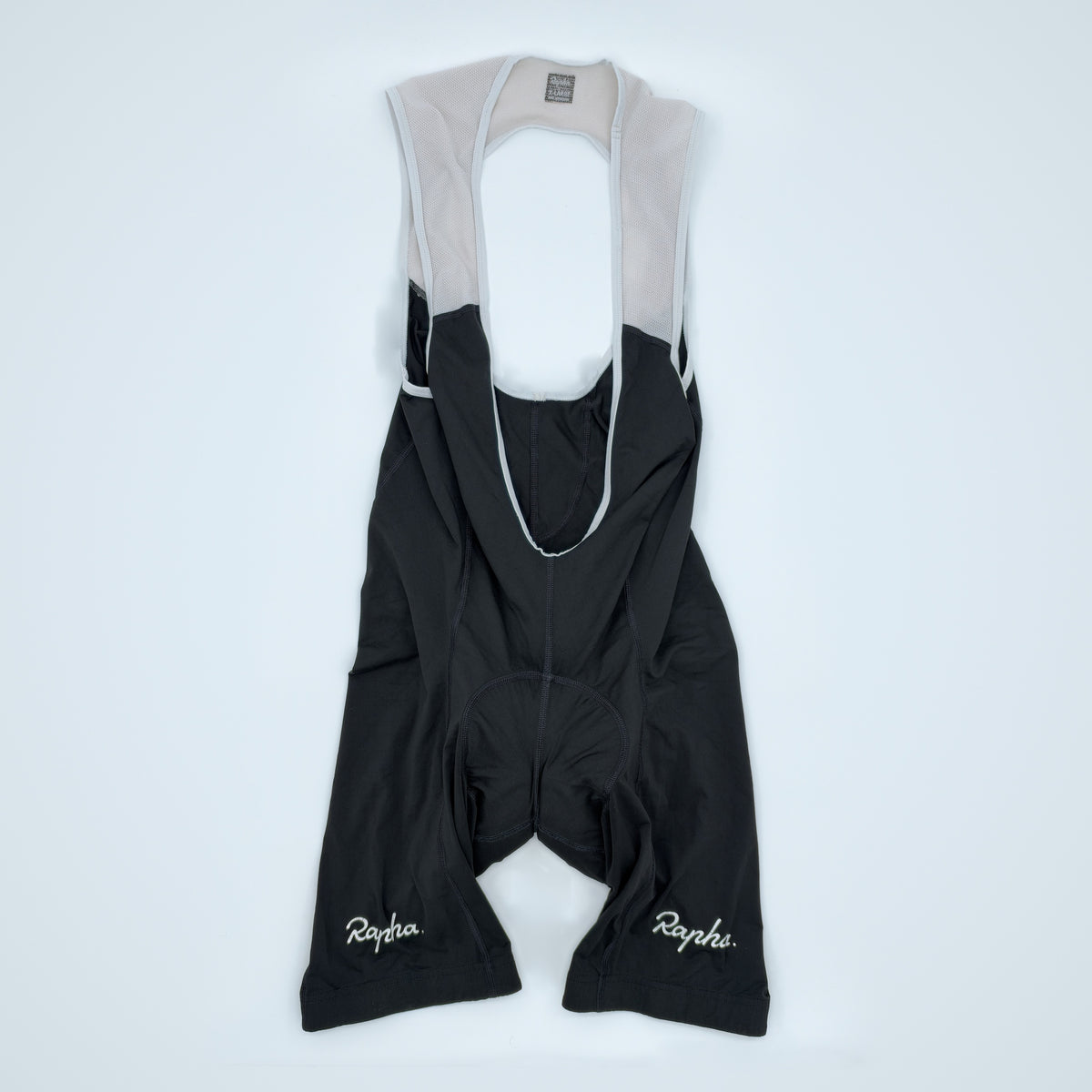 Rapha Classic Bib Shorts II flat front view in black with white straps