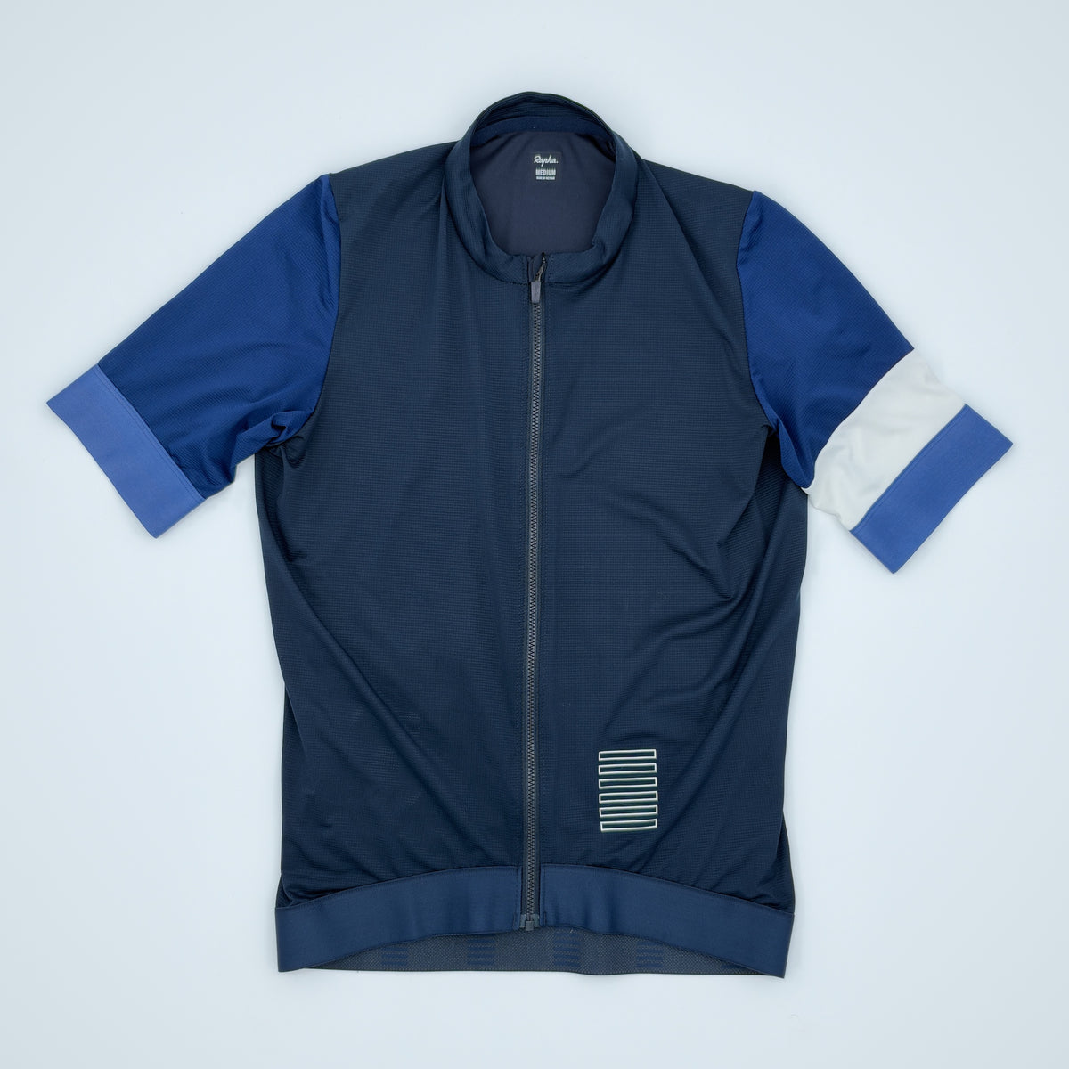 Rapha Pro Team Training Jersey flat front view in navy with blue sleeves