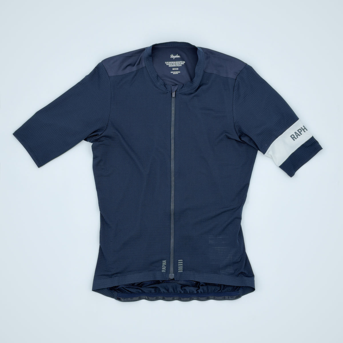 Rapha Pro Team Flyweight Jersey flat front view in navy