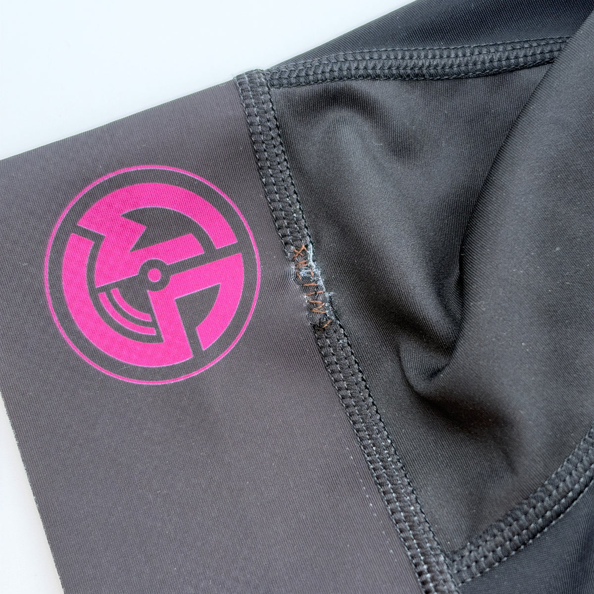 Close-up of the stitched seam repair on the leg