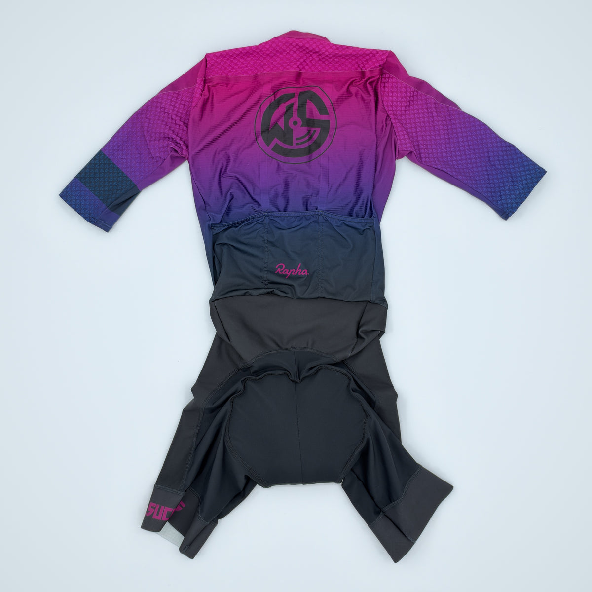 Rear view of the aerosuit, small race-number pin holes visible on the back